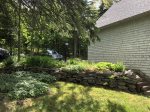 Driveway, parking, landscaping, and side yard